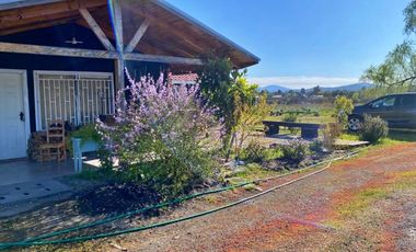 Se vende hermosa parcela con casa en la localidad de Quillon