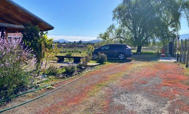 Se vende hermosa parcela con casa en la localidad de Quillon